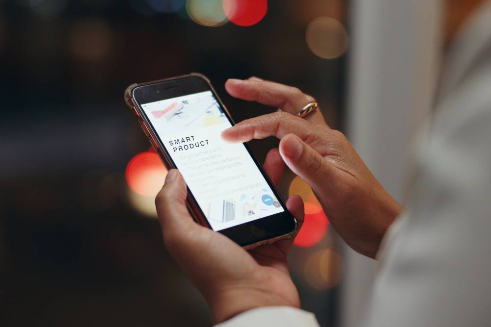 Night, screen and hands with woman, cellphone and connection with website information. Closeup, employee and evening with human, smartphone and internet with digital app, texting and communication